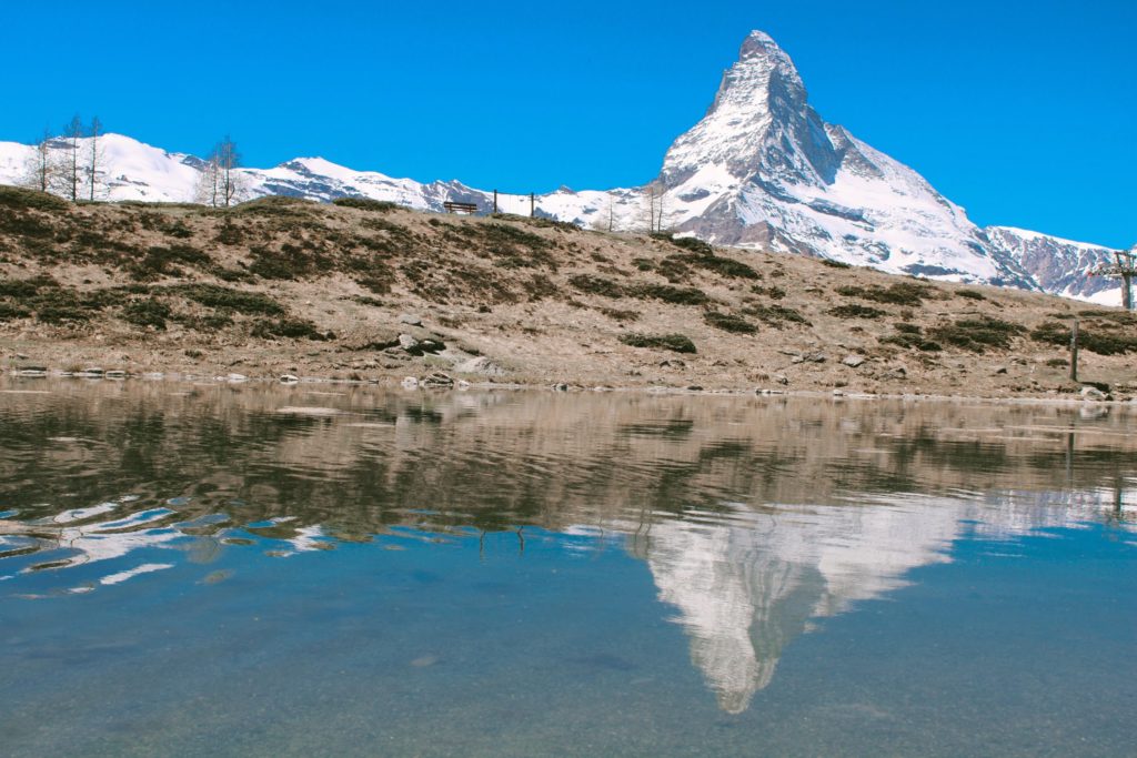 Reflection of the Matterhorn Mountain on Lisee Lake near the Sunnegga lift on a visit to Zermatt in the summer